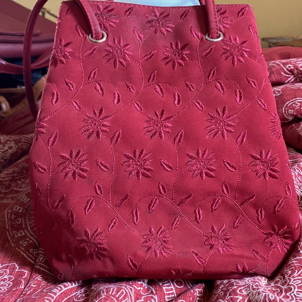 Adorable red embroidered Nine West bag. Long shoulder straps,two compartments.